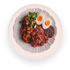A plate of jollof rice with boiled egg and greens